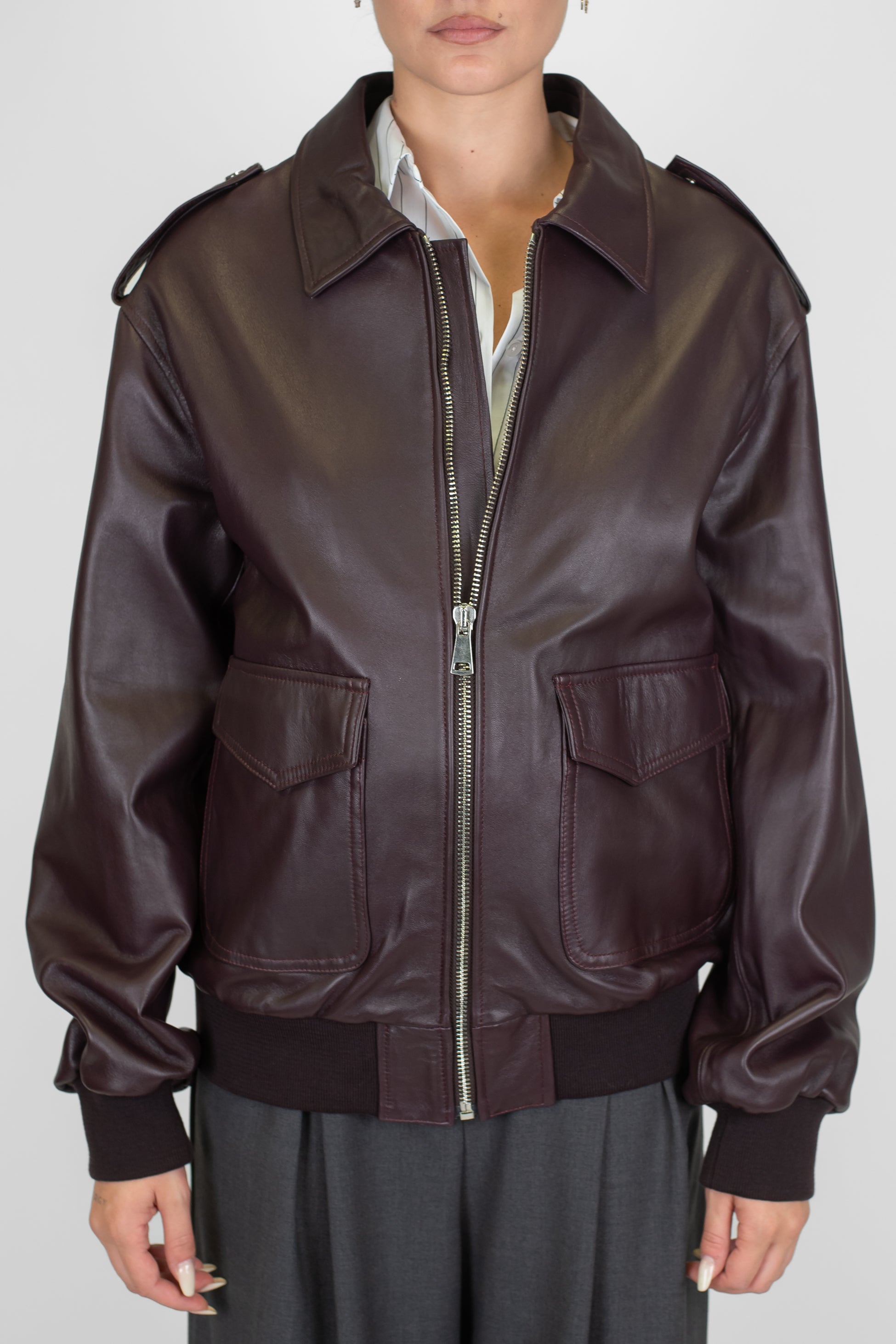 Tensione in - Bomber in vera pelle con tasconi frontali e chiusura zip