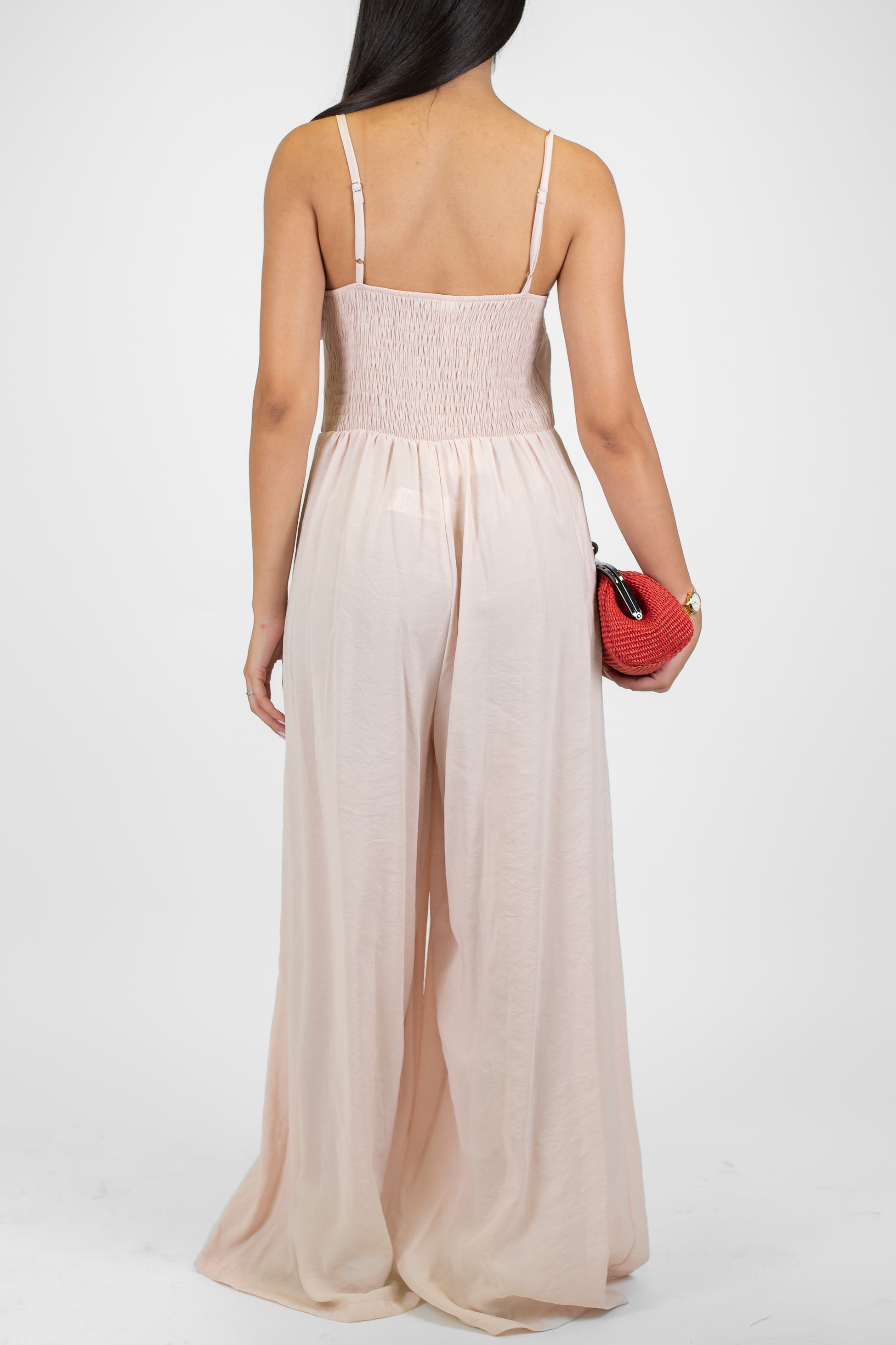 Tensione in - Tuta in modal con bretelline e spilla fiore