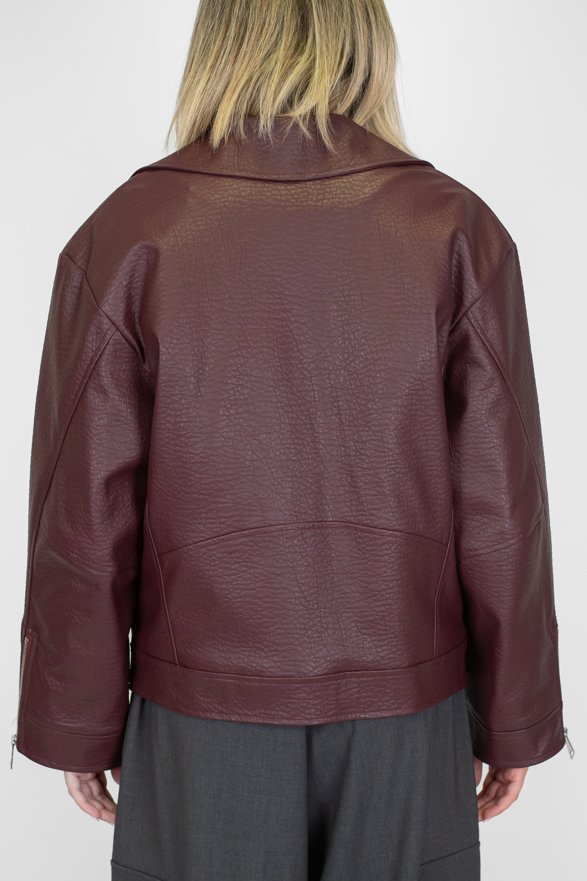 Tensione in - Giubbino biker in ecopelle con rever ampio e tasche con zip laterale