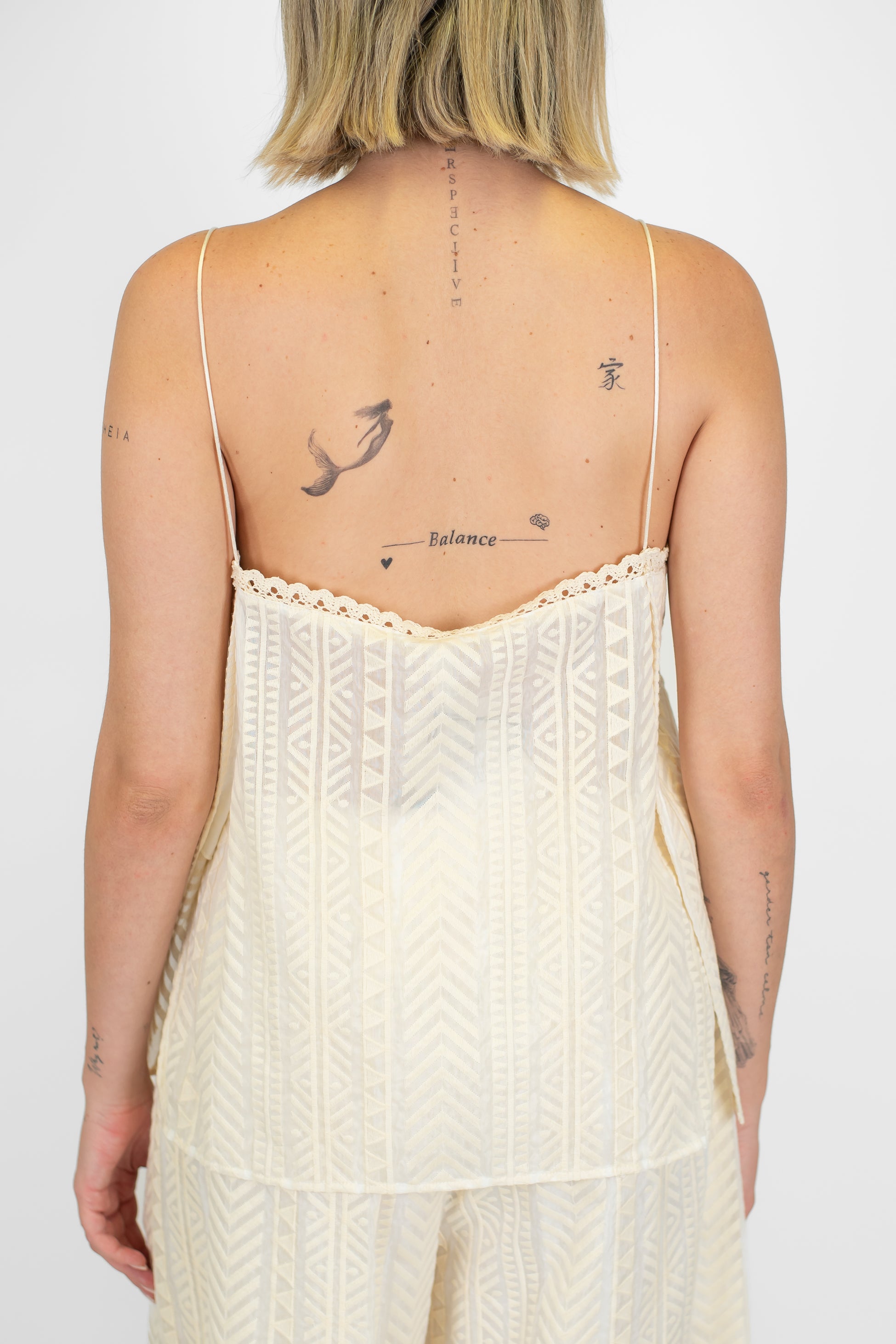 Tensione in - Top fantasia zig zag in mussola di cotone e seta con brfetelline