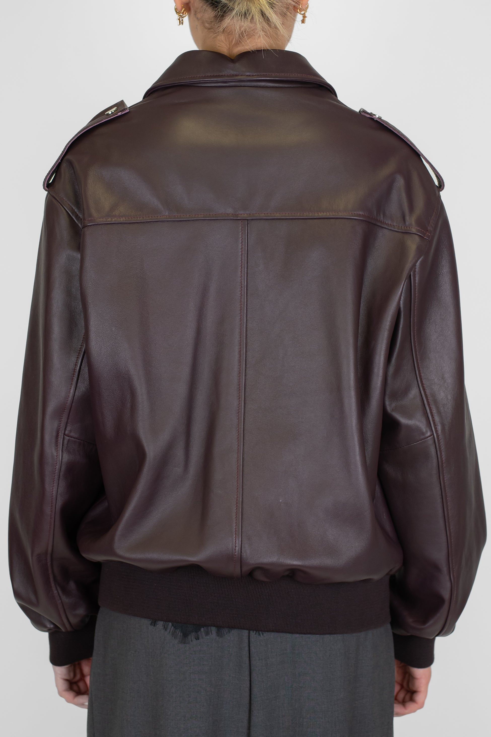 Tensione in - Bomber in vera pelle con tasconi frontali e chiusura zip