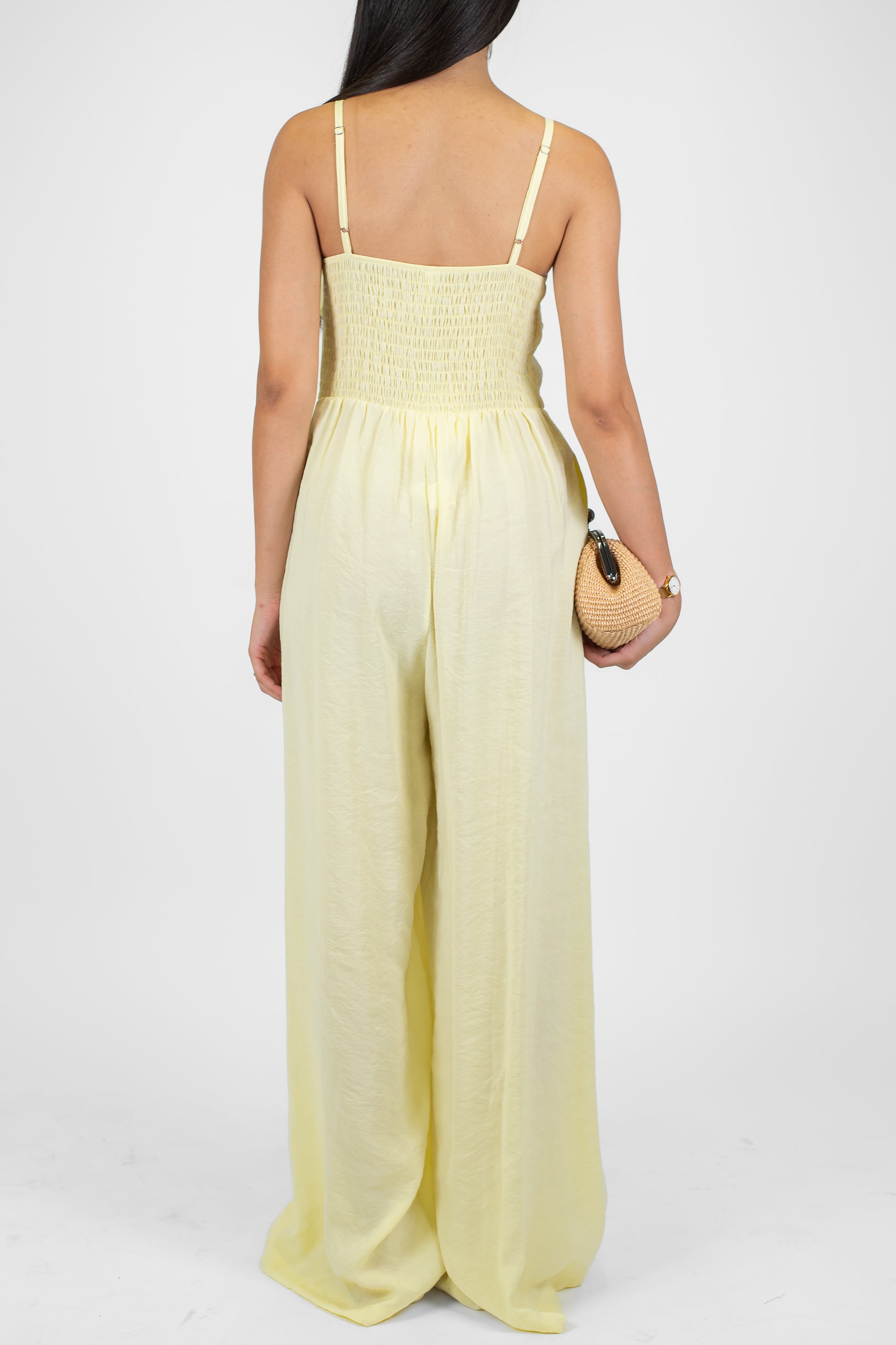 Tensione in - Tuta in modal con bretelline e spilla fiore