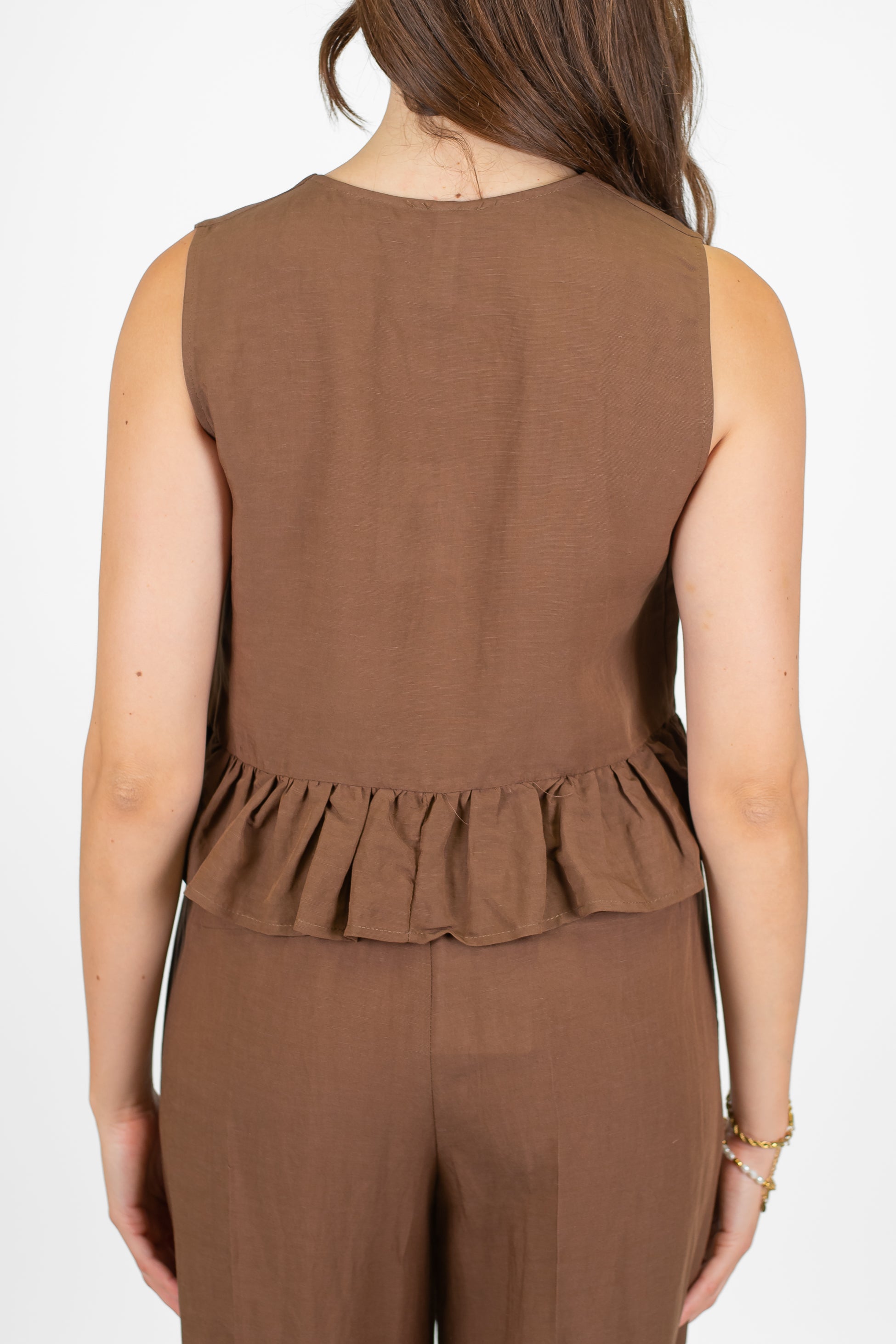 Tensione in - Gilet in misto lino e viscosa con chiusura laccetti e balza sul fondo