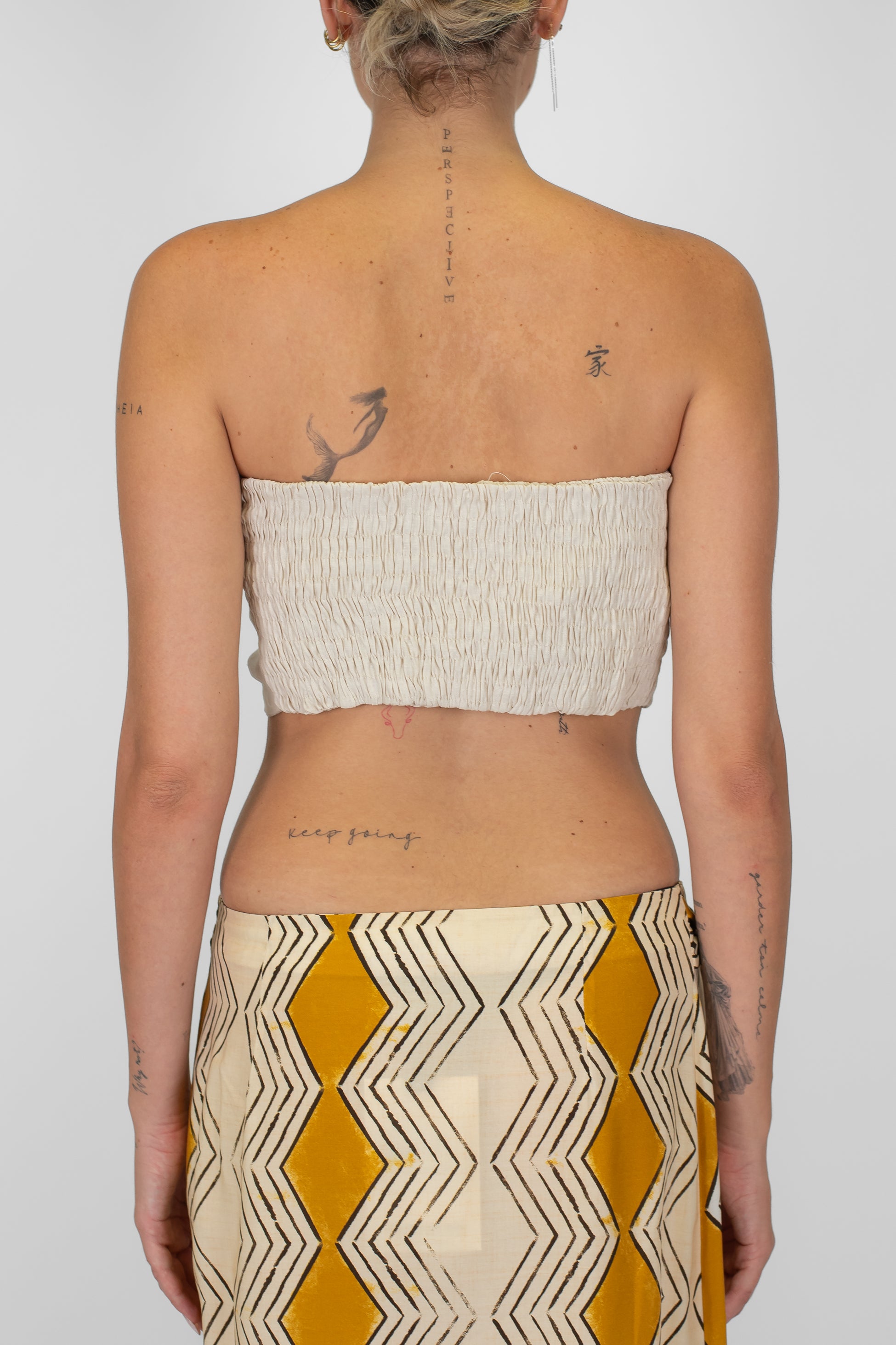 Tensione in - Top a fascia in viscosa/lino con elastico dietro