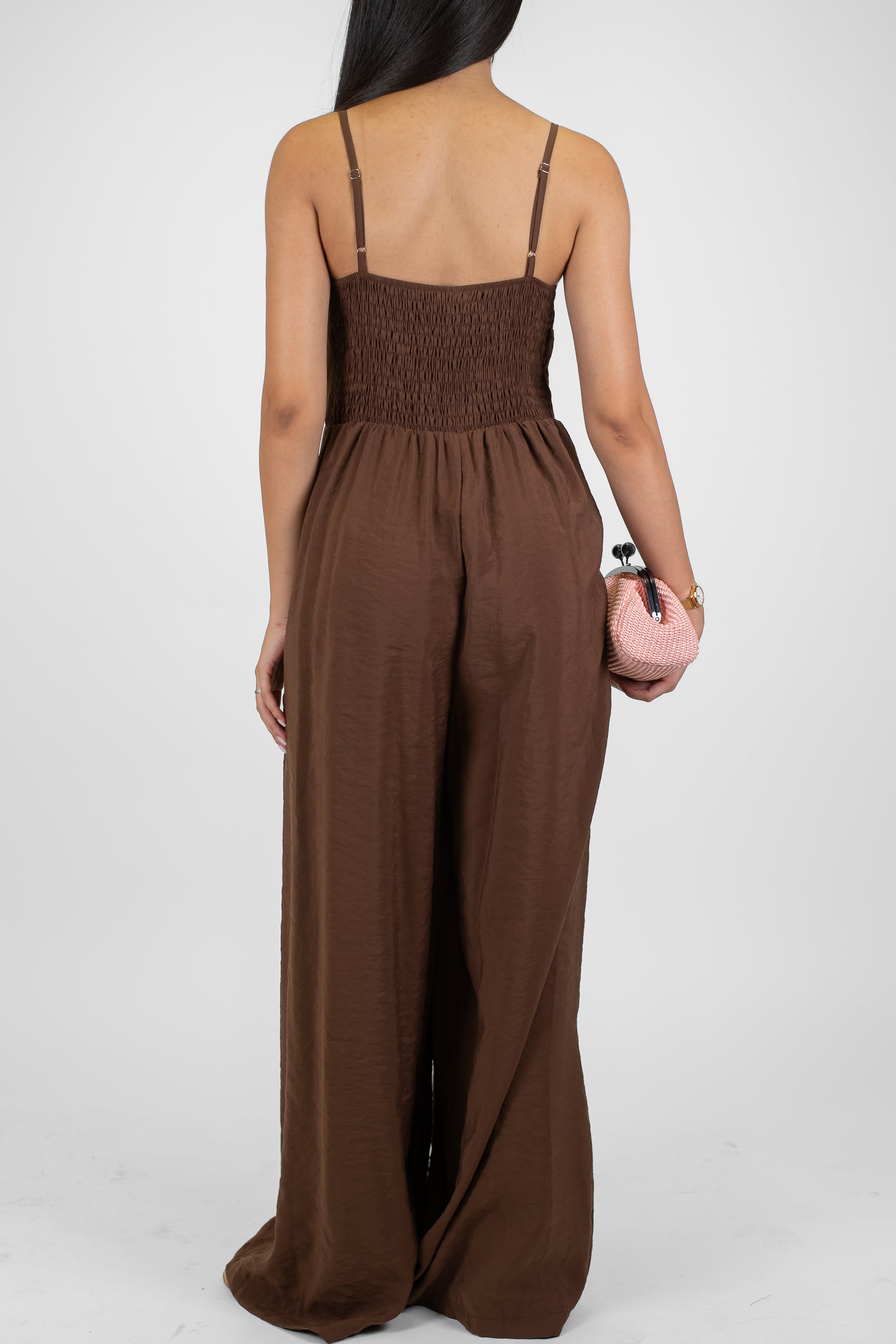 Tensione in - Tuta in modal con bretelline e spilla fiore