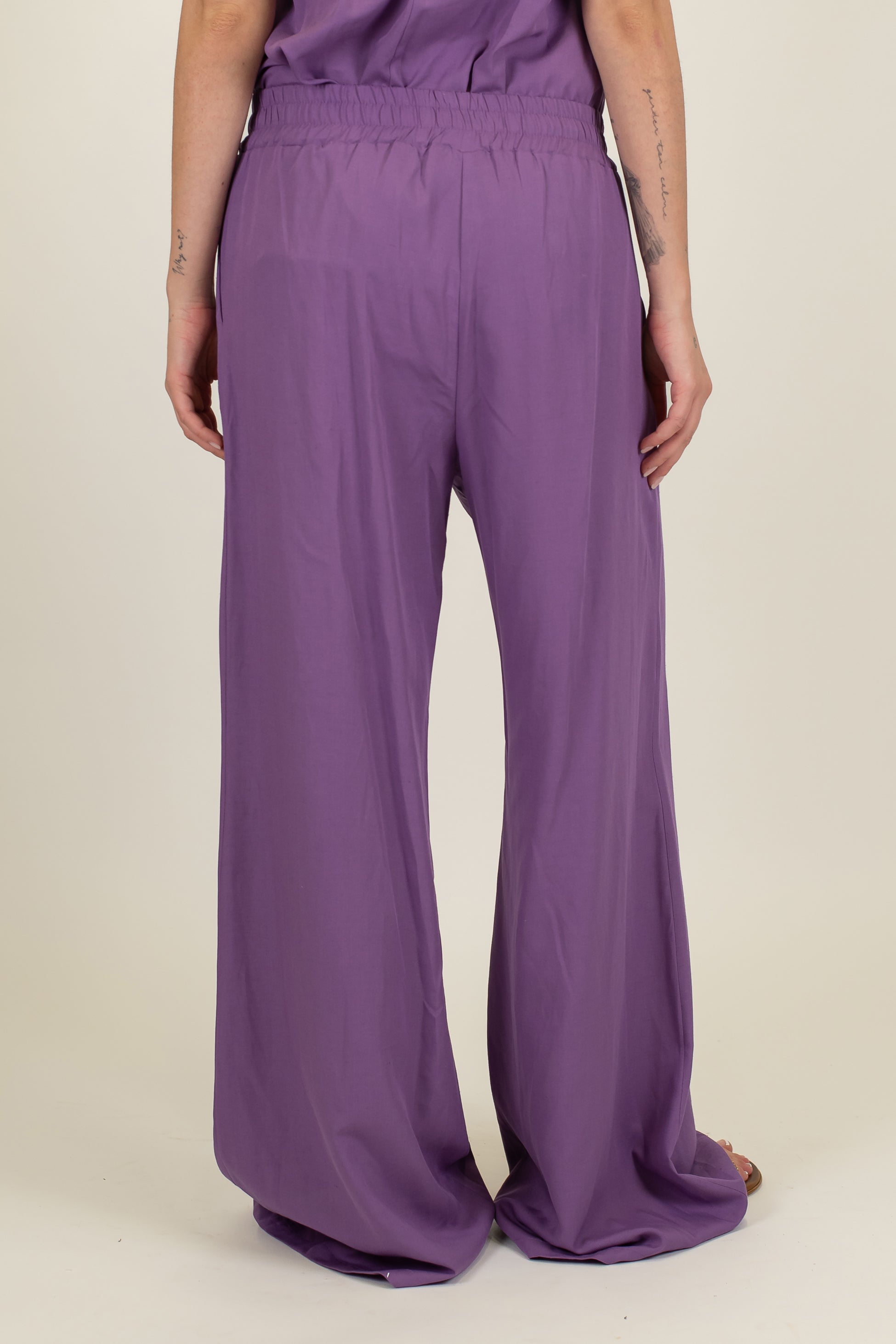 Tensione in - Coordinato in misto lino con top a fascia e pantalone palazzo con elastico sul retro