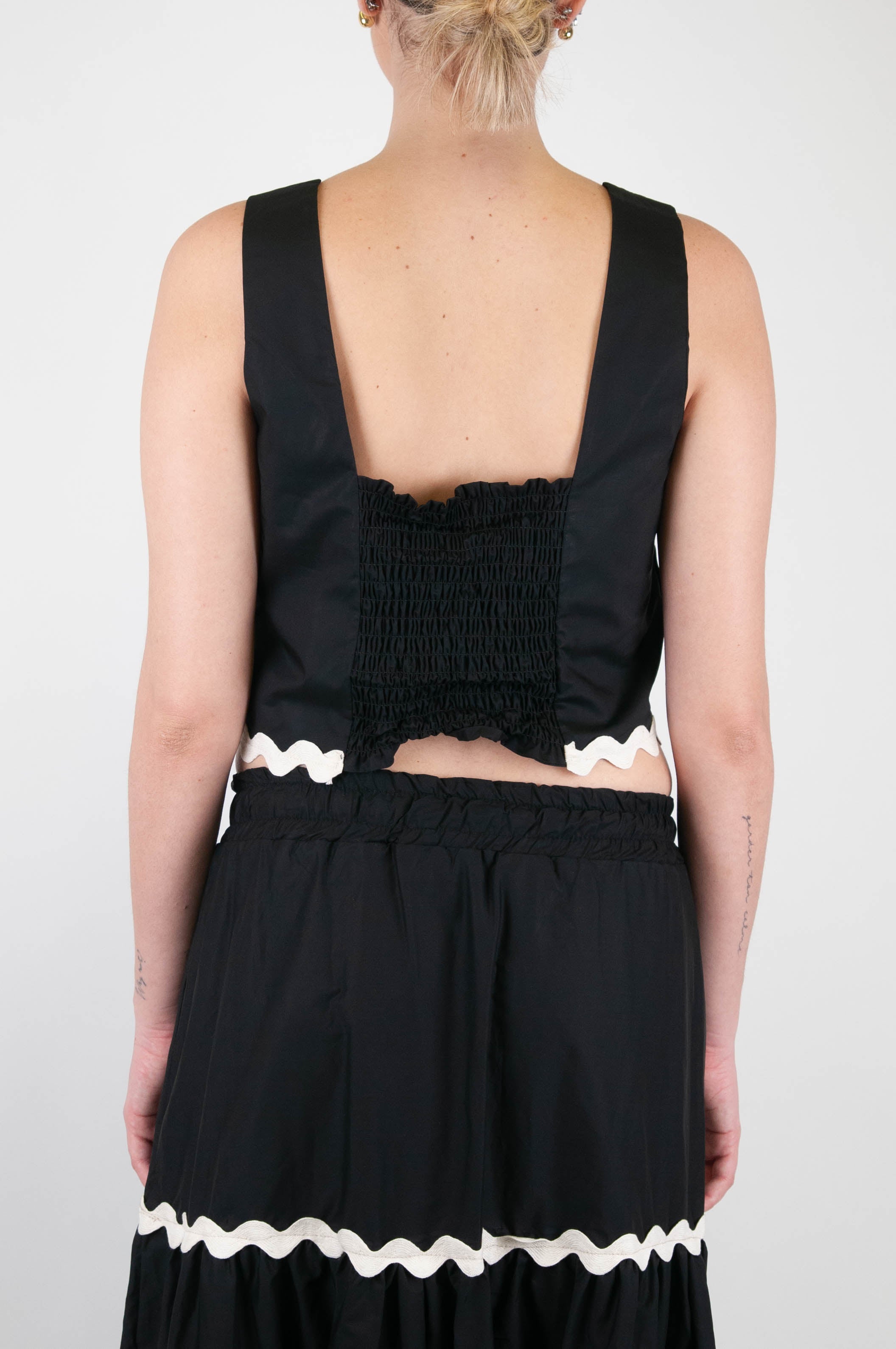 Tension in - Top with contrasting embroidery on the bottom