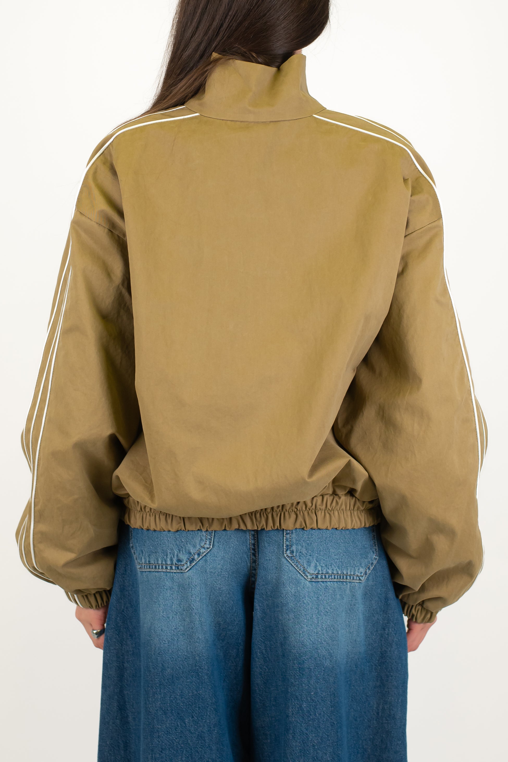 Tensione in - Bomber con chiusura zip e alamari ed elastico sul fondo