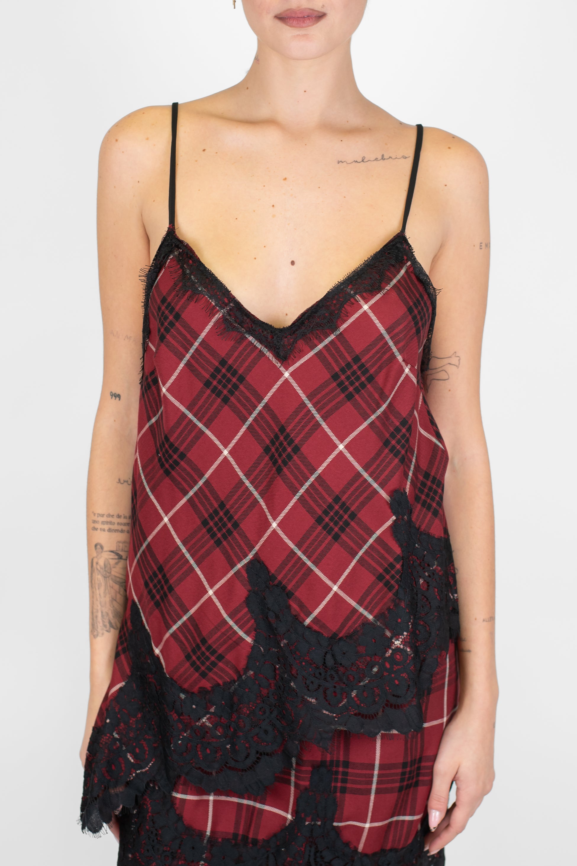 Tensione in - Top asimmetrico fantasia check con pizzo sul fondo