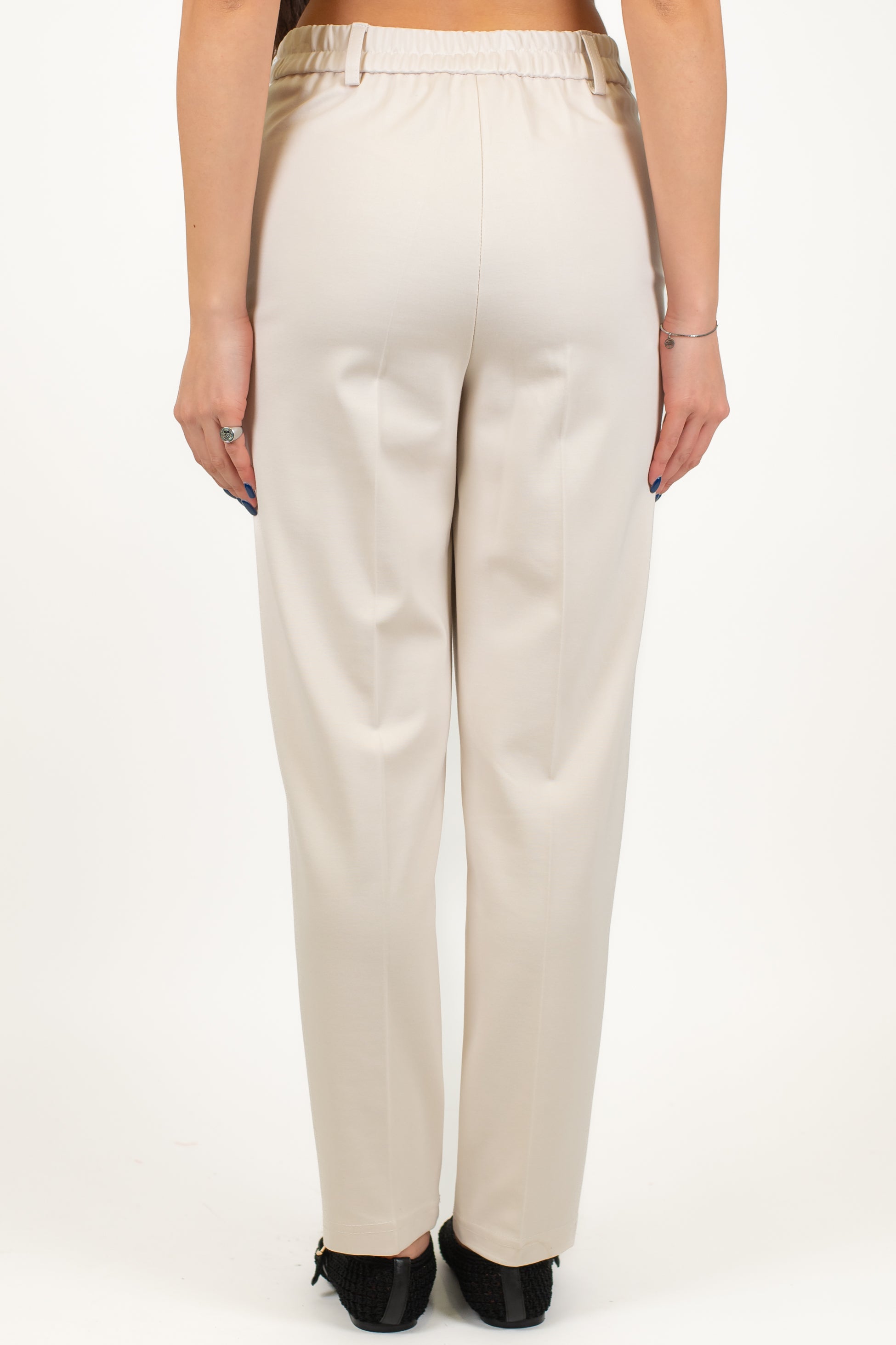 Tensione in - Pantalone slim in punto milano con elastico in vita