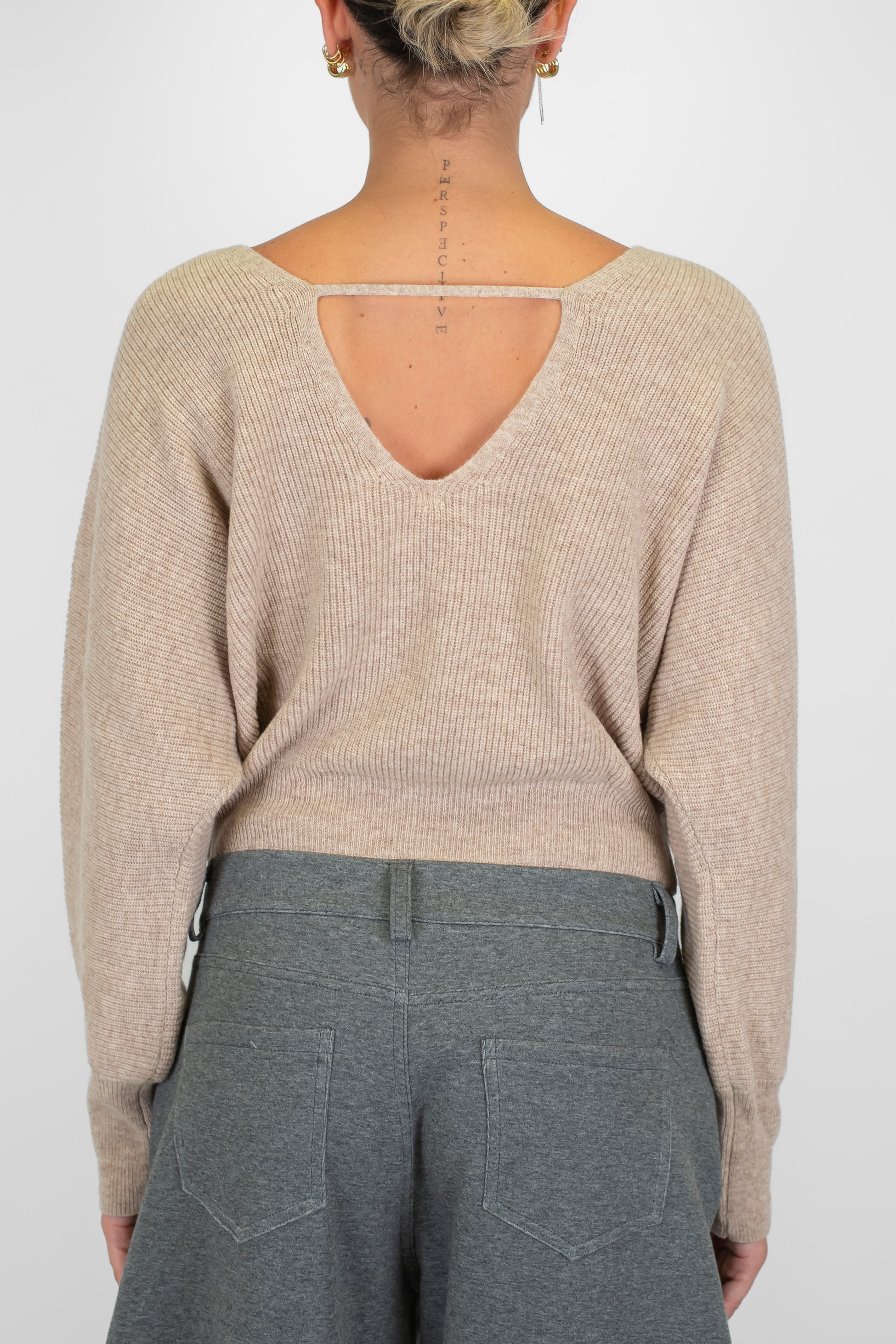 Tensione in - Maglia scollo a V fronte-retro in pura lana