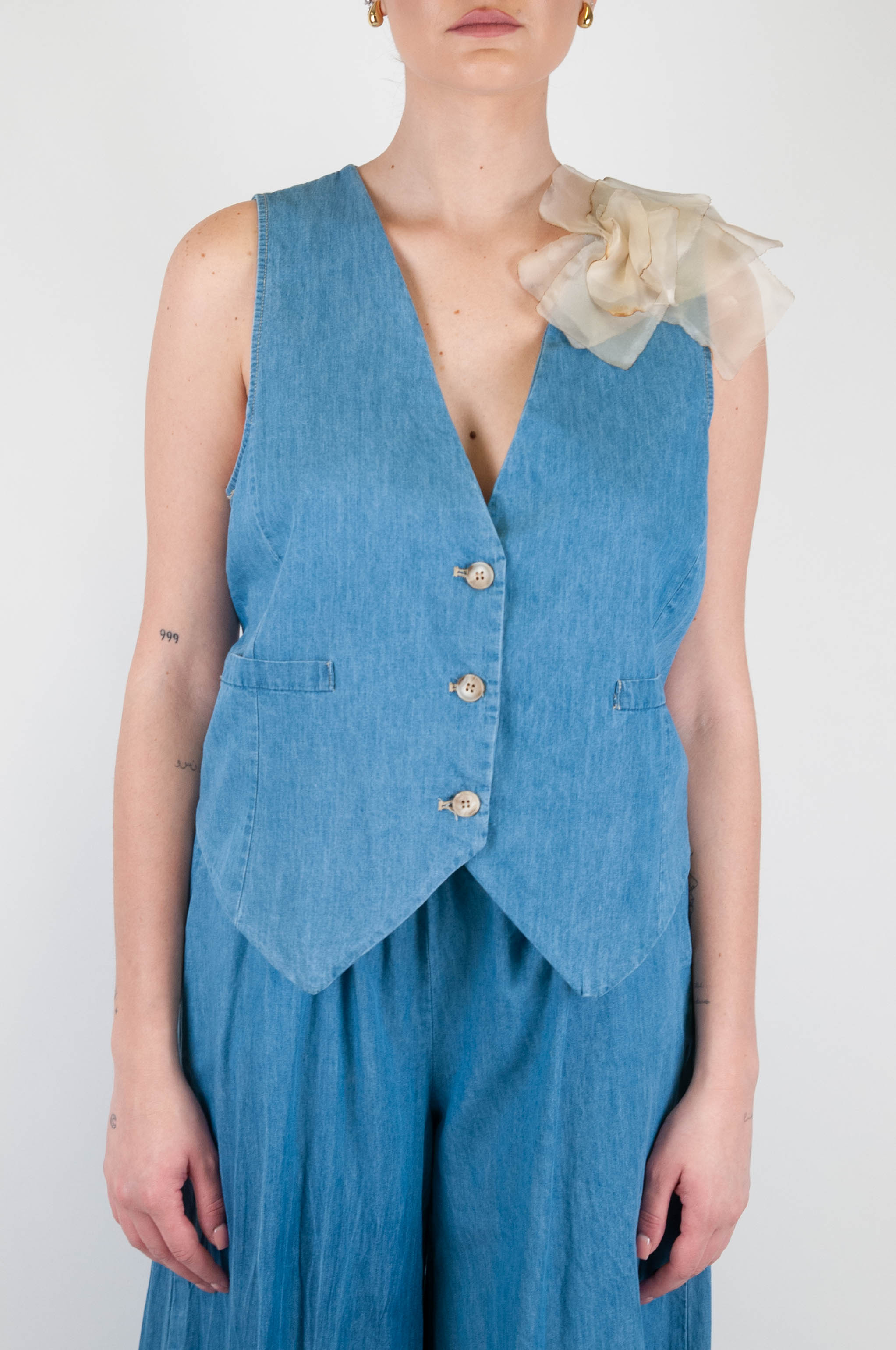 Motel - Chambray vest with flower brooch