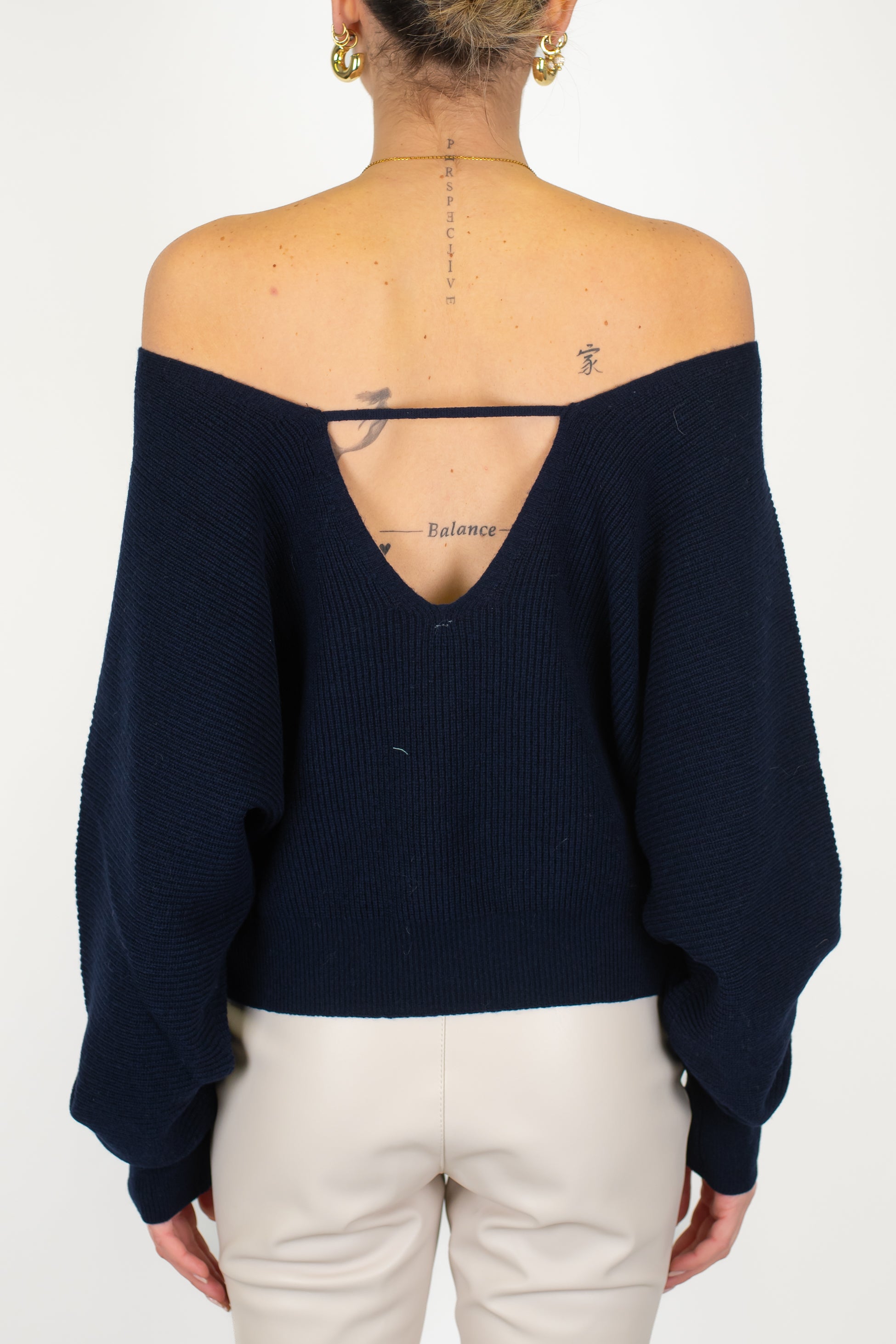 Tensione in - Maglia scollo a V fronte-retro in pura lana