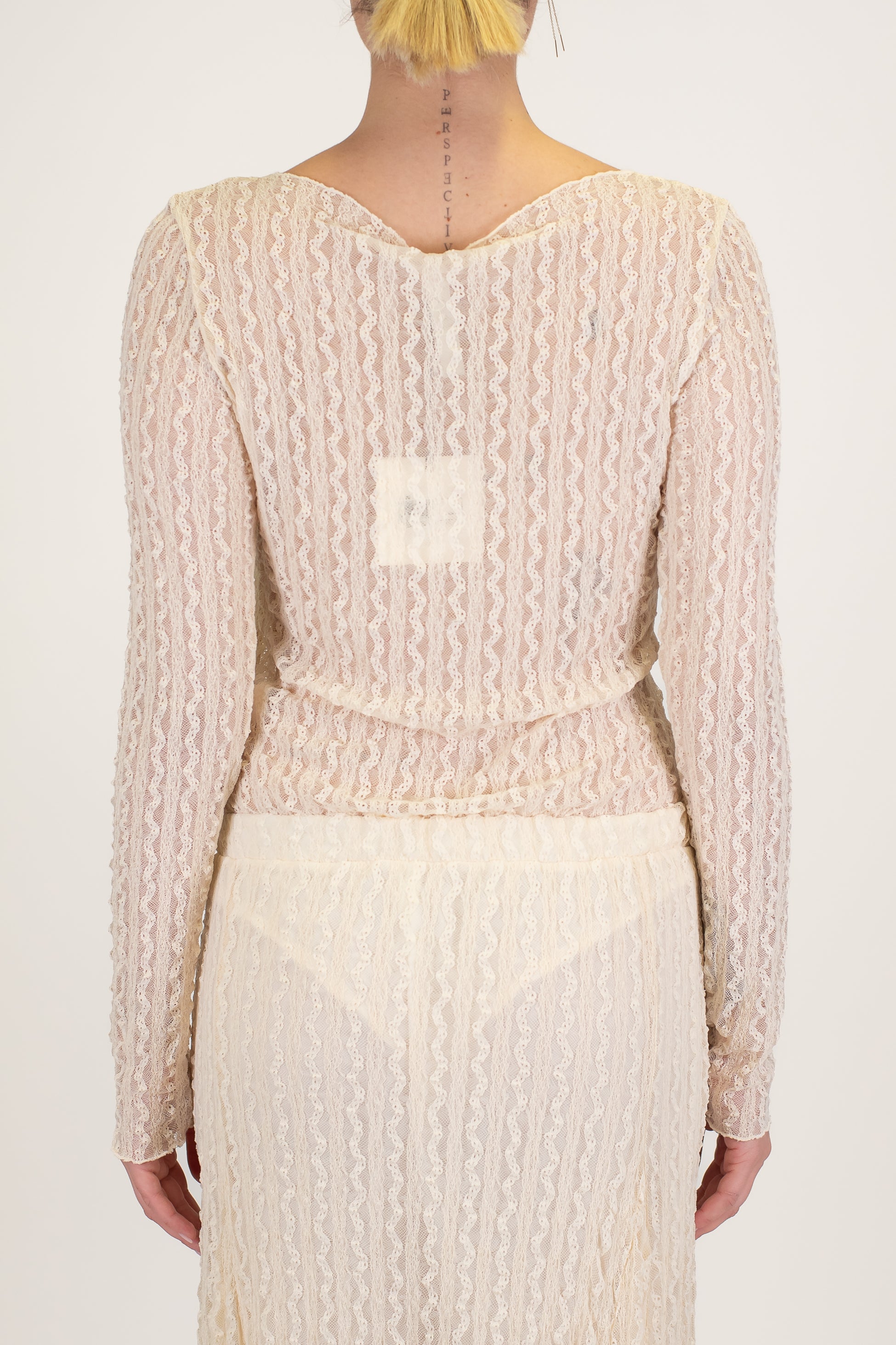 Tensione in - Body girocollo in crochet con manica lunga