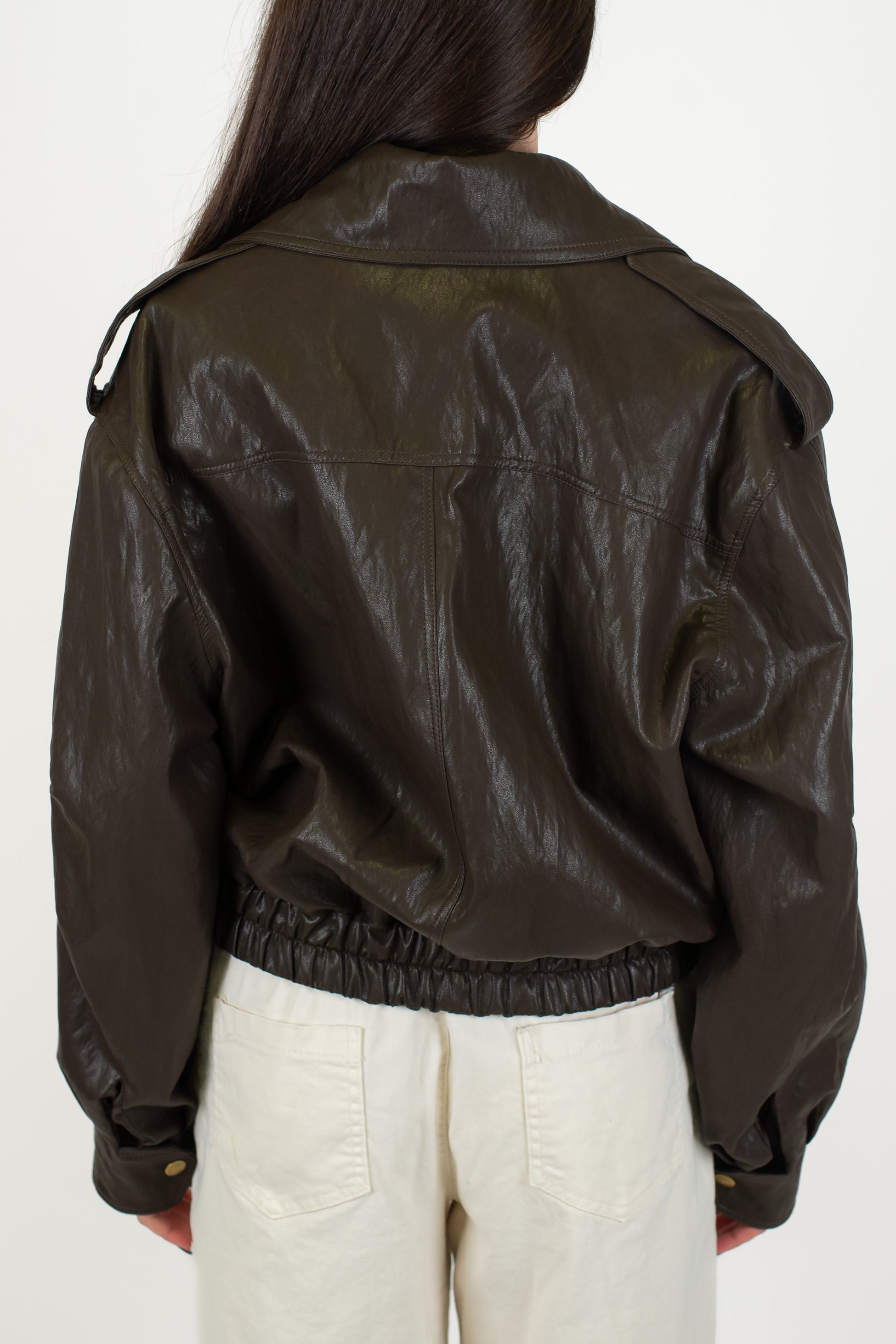 Tensione in - Bomber in ecopelle con tasconi laterali ed elastico sul fondo