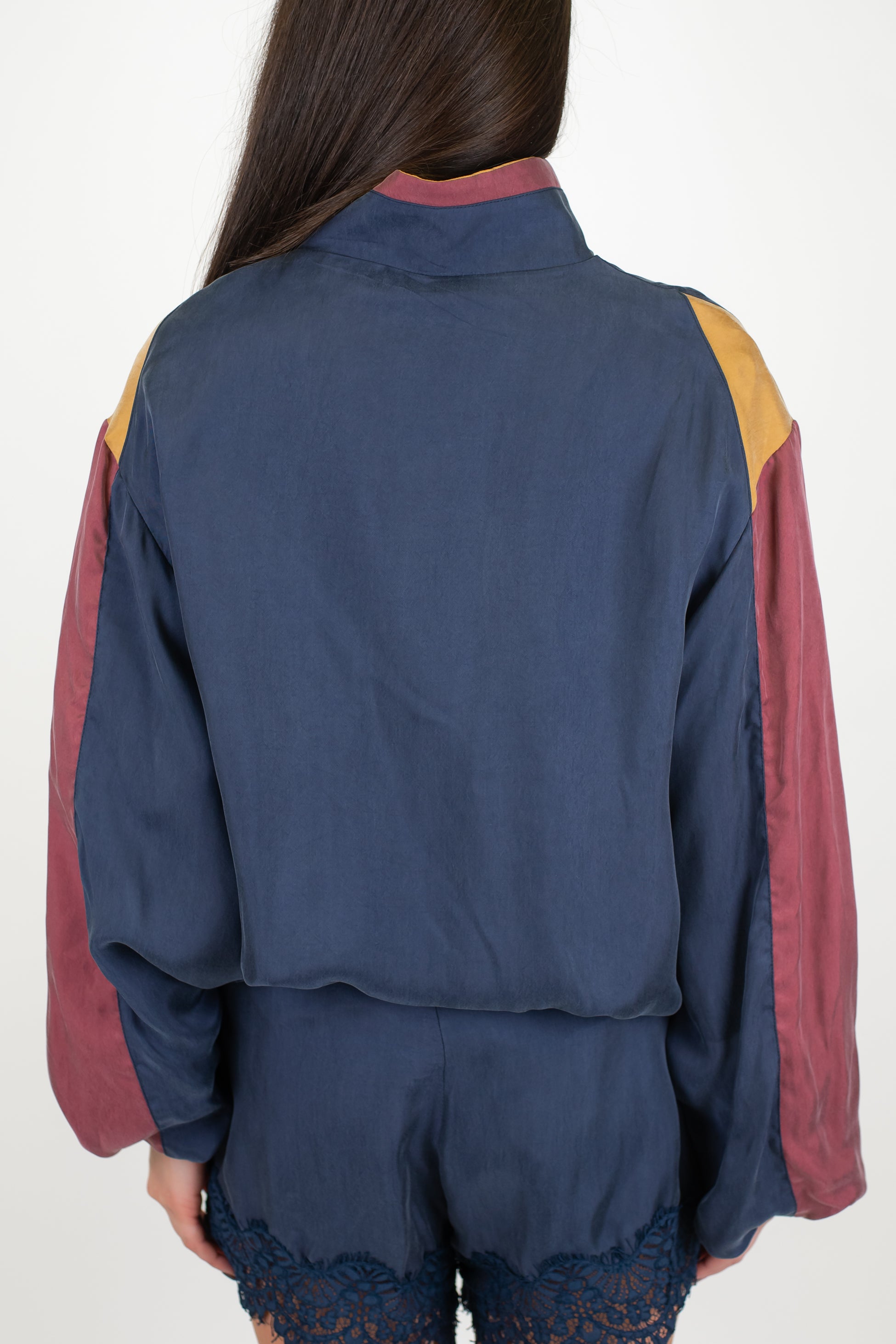 Tensione in - Bomber in cupro con maniche a contrasto ed elastico sul fondo