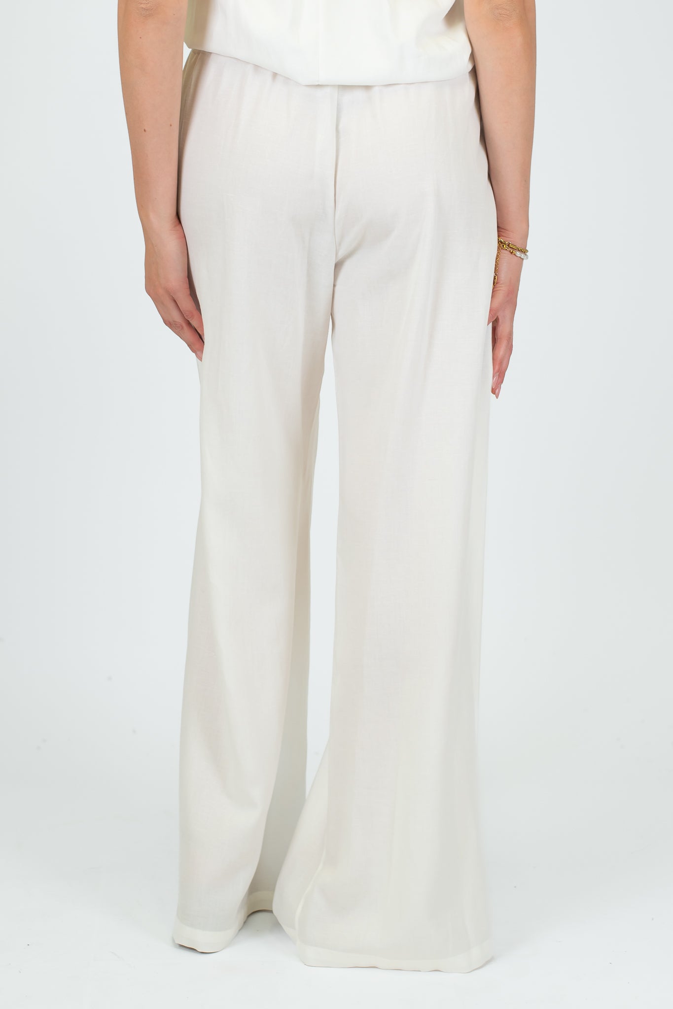 Tensione in - Coordinato in misto lino con top a fascia e pantalone palazzo con elastico sul retro