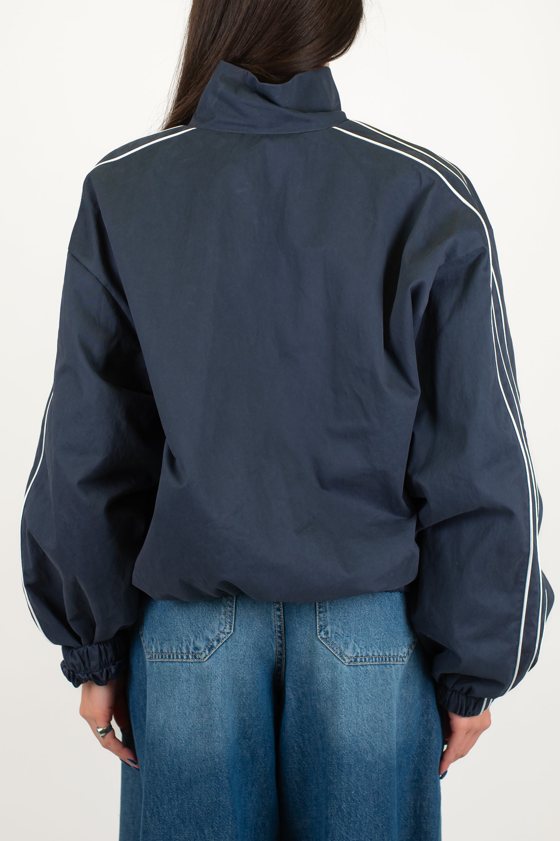Tensione in - Bomber con chiusura zip e alamari ed elastico sul fondo