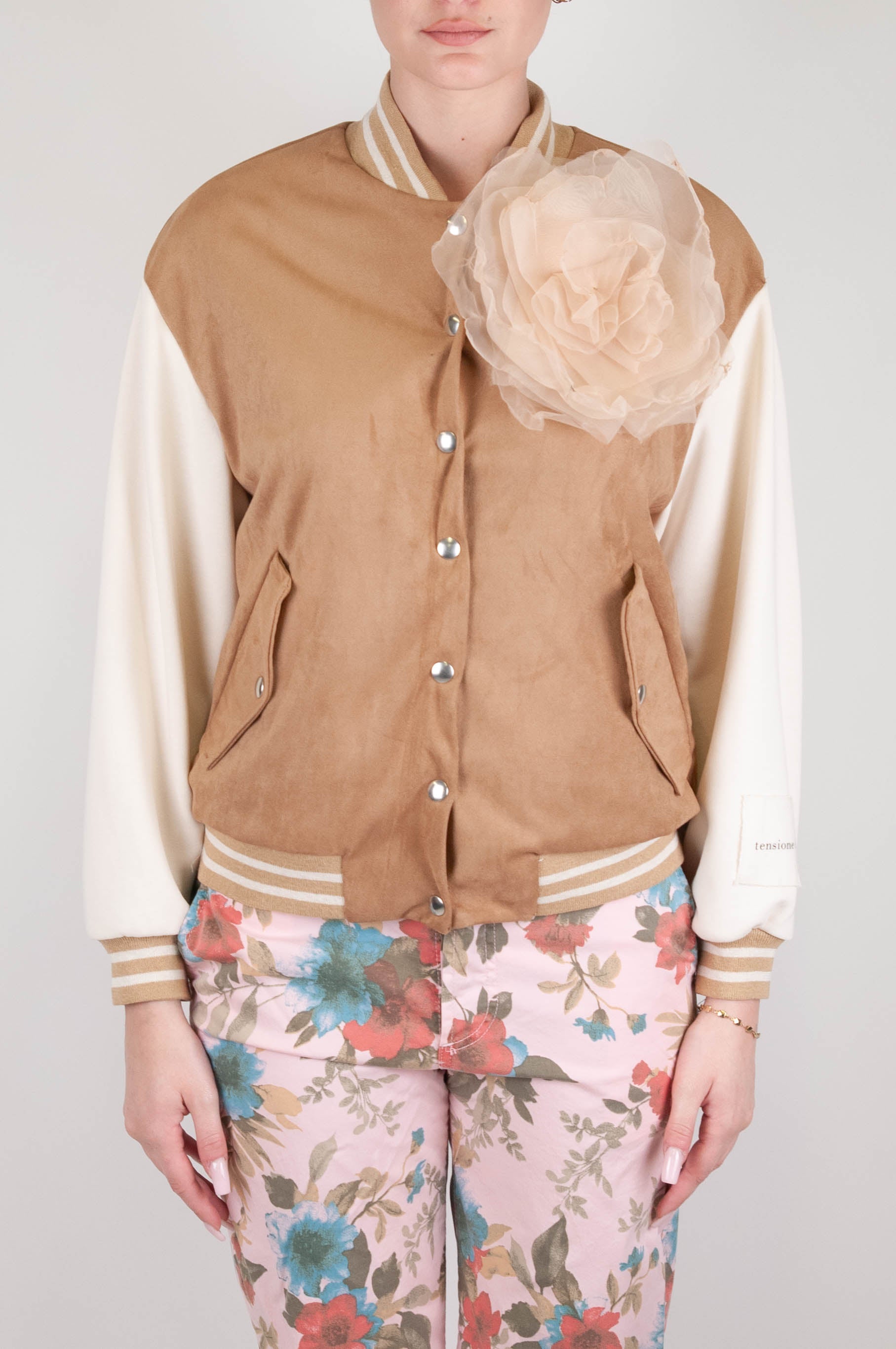 Tension in - Bomber jacket with contrasting sleeves and flower brooch