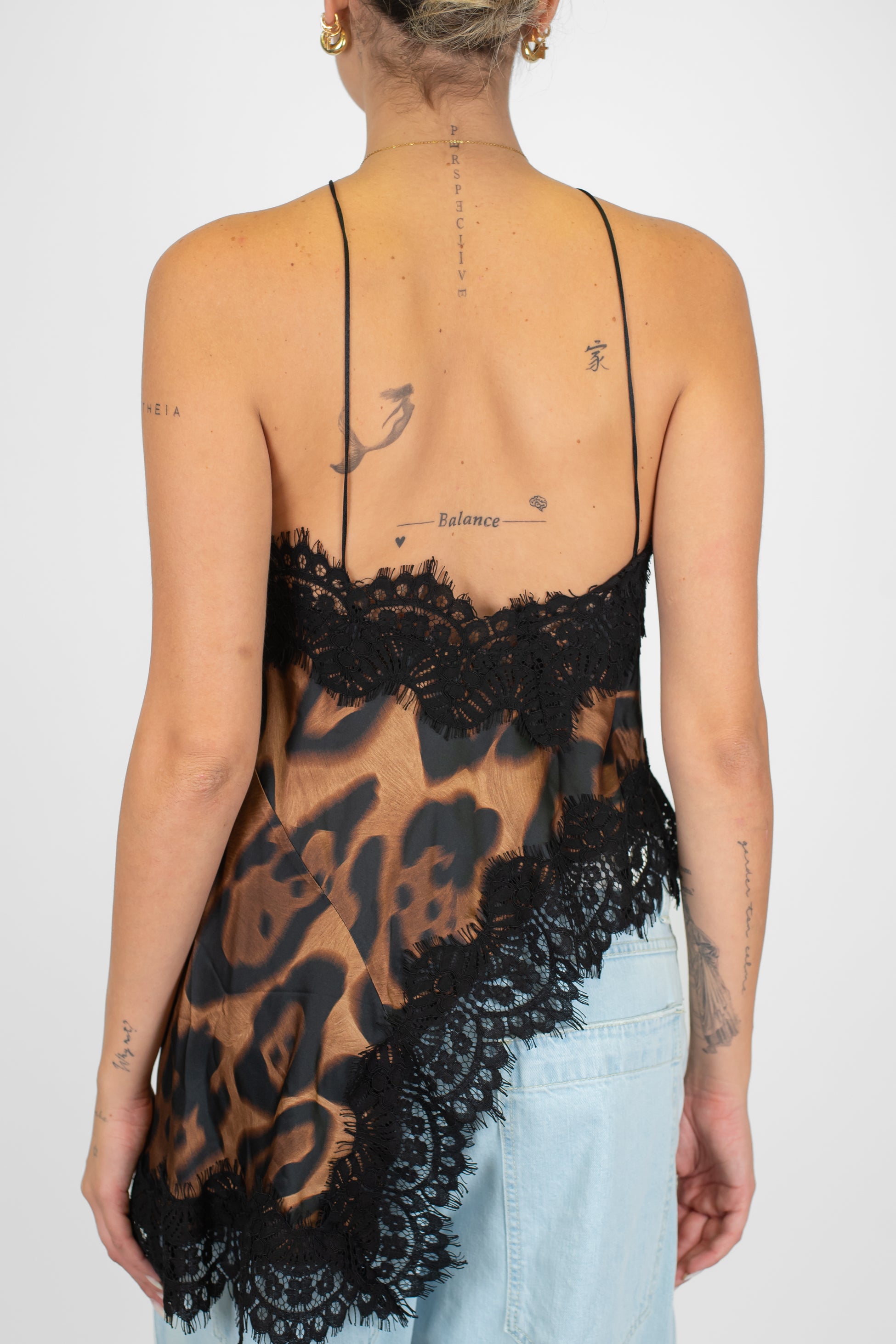 Motel - Top asimmetrico fantasia animalier in viscosa con orli in pizzo