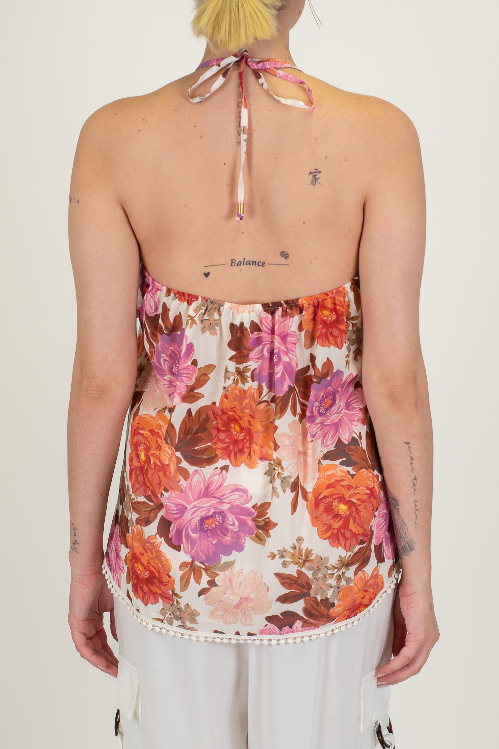 Tensione in - Top fantasia floreale in mussola di cotone con volant e profili in crochet