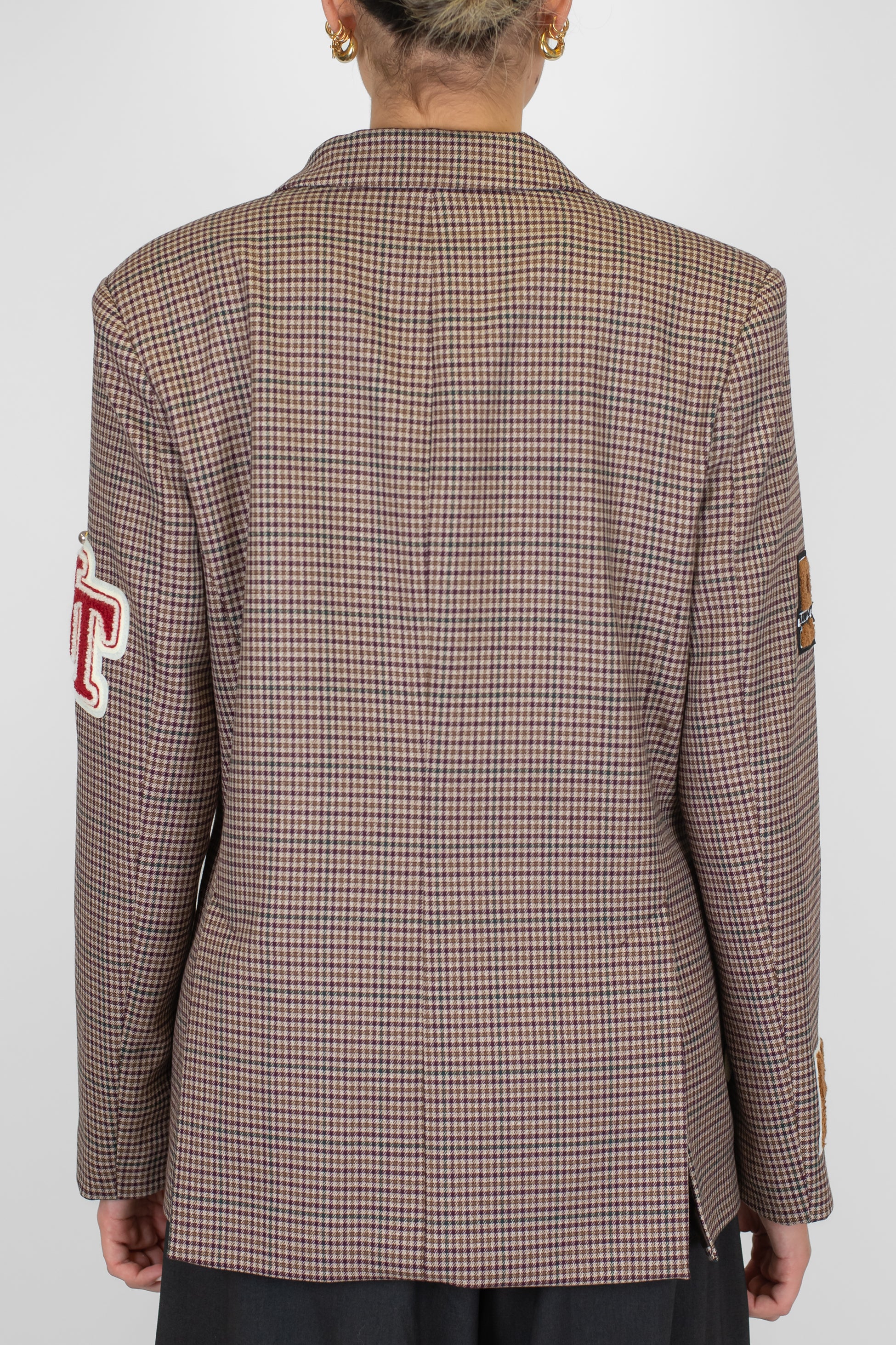 Tensione in - Giacca doppiopetto fantasia pied de poule con patch scritte