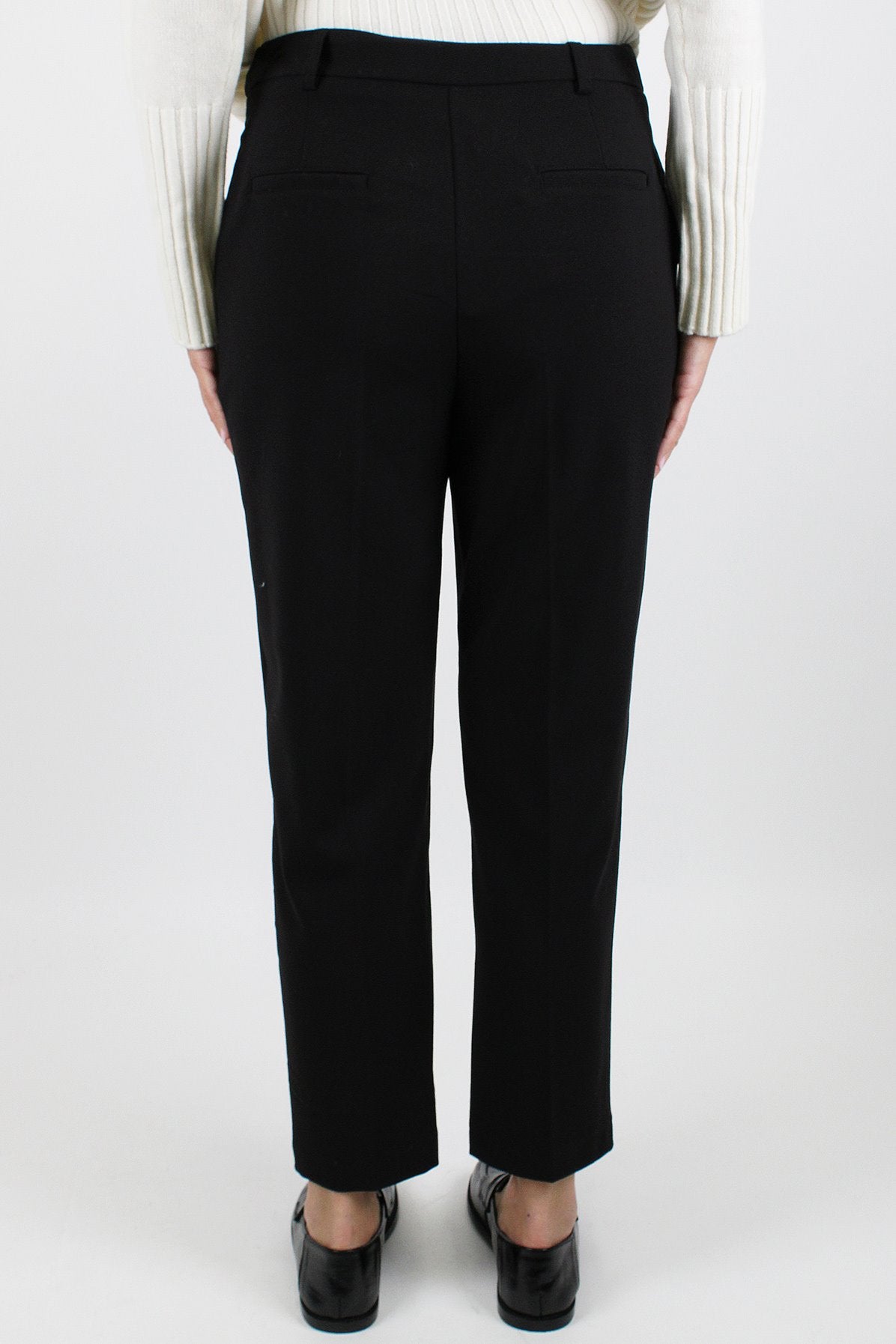 Tensione in - Pantalone slim con abbottonatura asimmetrica