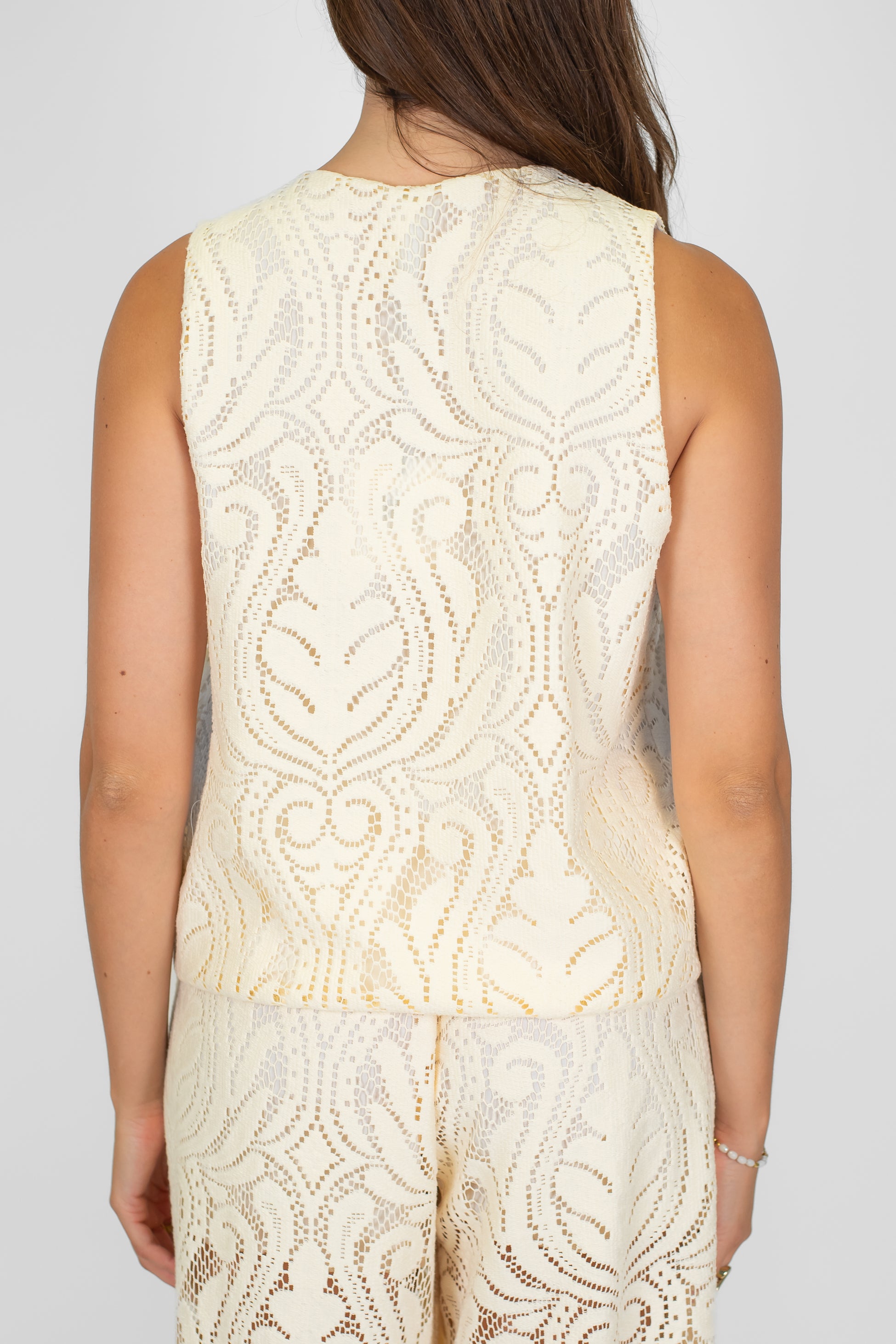 Tensione in - Gilet in pizzo con laccetti